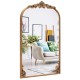 Arched gold baroque mirror with ornate frame, perfect for enhancing entryways and living rooms.