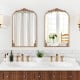 Arched gold vintage ornate mirrors with metal frames, perfect for enhancing entryways or bathrooms.