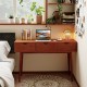 48-inch walnut writing desk with three drawers, solid wood legs, and ample surface for laptop and books in a cozy.