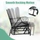 Patio glider rocking chair with gray thick cushion and curved armrests, designed for comfortable outdoor relaxation.