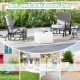 Patio glider rocking chair with thick gray cushion and curved armrests, perfect for outdoor relaxation in various.