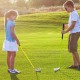 Kids practicing golf with an individual club featuring a fiberglass shaft and aluminum head, perfect for ages 8-10.