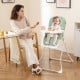 Compact highchair in green with adjustable tray, removable cushion, and safety harness, ideal for mealtime convenience.