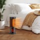 Portable 17-inch black tower space heater with 135° oscillation, 1500W power, and adjustable thermostat for cozy warmth.