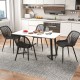 Curved seat and breathable cutout backrest of a black modern kitchen chair with metal legs, ideal for stylish dining.