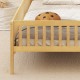 Twin size Montessori bed with house-shaped headboard, solid pine wood frame, and built-in storage shelf for kids' room.