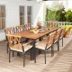 9-piece patio dining set featuring acacia wood and cushioned chairs, perfect for outdoor gatherings with an umbrella.