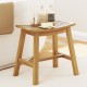 Teak wood shower stool with curved seat and slatted design, ideal for inside shower or as a plant stand.