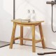 Teak wood shower stool with curved seat, slatted design for drainage, ideal for inside shower or as a plant stand.