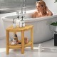 Teak wood shower bench with storage shelf, featuring a corner design and slatted surface, ideal for bathroom essentials.