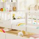 Twin size house bed with white frame, colorful bedding, and house-shaped storage headboard for kids' room organization.