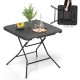 Foldable 2.6FT dining table with wood grain HDPE surface, non-slip foot pads, ideal for indoor or outdoor use.