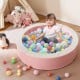 Detachable pink foam ball pit with 50 colorful ocean balls, spacious for 2 children, ideal for safe indoor play.