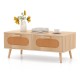 Mid-century modern rattan coffee table with two storage drawers and natural wood finish, perfect for stylish living.