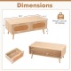 Mid-century modern rattan coffee table with two storage drawers, natural wood finish, ideal for stylish living room.