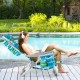 Foldable beach chair in green with adjustable backrest, cup holder, and storage pockets, perfect for poolside.