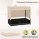 Elevated wicker dog house in black for small to medium breeds, featuring a removable cushion and durable PE rattan.