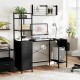 Office desk with open shelves in black, featuring RGB LED lights, power outlets, and ample storage for work supplies.