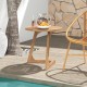 Teak wood side table with a slatted tabletop and triangle base, elegantly placed by the poolside for outdoor gatherings.