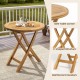 Round patio teak wood dining table with slatted top and X-shaped frame, perfect for outdoor dining on the balcony.