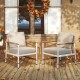 Two patio aluminum sofa chairs with wicker backrests and soft cushions, perfect for outdoor relaxation on a balcony.