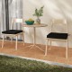 Black outdoor chair cushion set of 2, waterproof and fade-resistant, placed on dining chairs for added comfort.