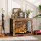 Dog crate furniture with cushion, double doors, and rustic wood finish, ideal for small/medium dogs in a stylish home.