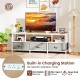 TV stand with built-in charging station, featuring 2 AC outlets and USB ports, designed for TVs up to 65 inches.
