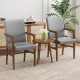 Gray upholstered accent chair featuring a solid rubber wood frame and armrests, ideal for stylish living room seating.