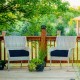 Navy 21-inch patio chair seat cushions on wicker chairs, designed for comfort and outdoor use with waterproof fabric.