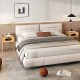 Bamboo nightstand with decorated drawer, showcasing rustic grain and modern design, perfect for bedroom decor.