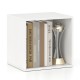 White cube storage organizer showcasing books and a trophy, ideal for maximizing space in any room.