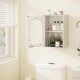 White bathroom wall cabinet with tempered glass door and adjustable shelf, ideal for organized storage in any room.