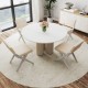 Round dining table set with two white padded rubber wood chairs, perfect for modern farmhouse aesthetics in dining.