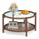 Round coffee table with tempered glass top and hand-woven rattan shelf, perfect for living room decor and functionality.