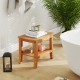 20-inch non-slip shower bench with a curved top, solid teak construction, and two-tier storage shelf for towels.