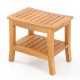 Curved top 20-inch teak shower bench with storage shelf, slatted design for drainage, ideal for bathroom use.