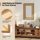 Rattan decorative wall mirror with a sturdy wooden frame, ideal for living room or bathroom, shown in a stylish setting.
