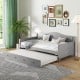 Twin size gray daybed with trundle on wheels, featuring a solid pine wood frame and elegant design for versatile use.