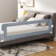Foldable 71-inch baby bed guard rail in gray with adjustable safety strap, designed for toddler safety and stability.