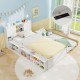 Twin size bed frame with trundle in white, featuring storage headboard and power outlets for convenient charging.