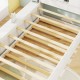 Twin size bed frame with wooden slats and trundle, featuring a solid structure and recessed power outlets for.