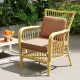 Single outdoor patio chair with brown cushion, crafted from breathable olefin fabric for comfort and durability.