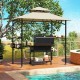 Outdoor grill gazebo with beige 2-tier canopy, side shelves, and hooks for tools, perfect for backyard barbecues.