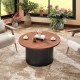 Round coffee table with walnut wooden top and solid wood frame, featuring a wave-shaped support post for stability.