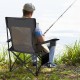 Reclining camping chair in gray with removable footrest, adjustable backrest, and side storage pocket for fishing trips.