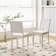White wood dining chair set of 2 with rubber wood legs, featuring a curved backrest for comfort in a cozy kitchen.