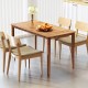 Rectangular outdoor dining table made of acacia wood, seating 4-6 people, with a slatted tabletop for easy cleaning.