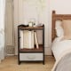 Nightstand with rustic brown wood surface, open storage shelf, and fabric drawer, perfect for bedroom or living room.