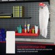 Fuel transfer pump with nozzle and storage bag, organized on pegboard, ideal for gasoline and diesel transfer.